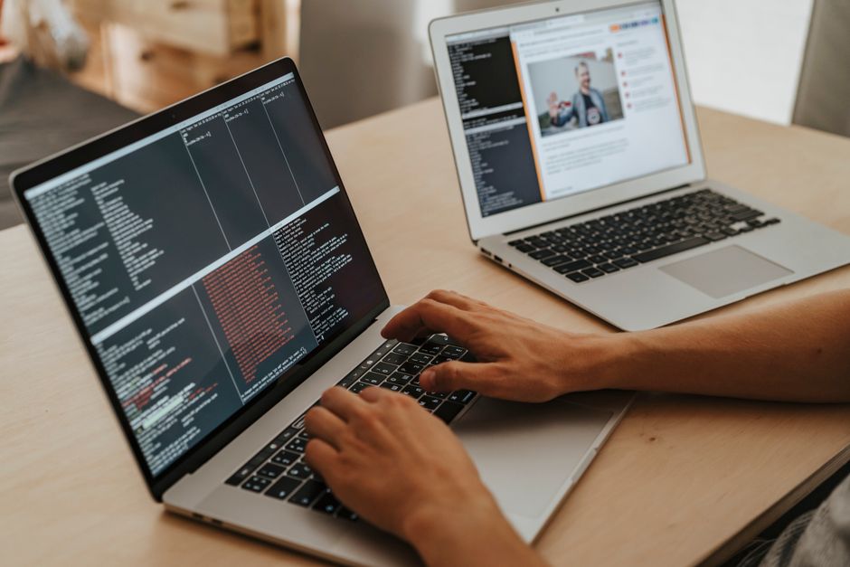 A child learning to code on a laptop