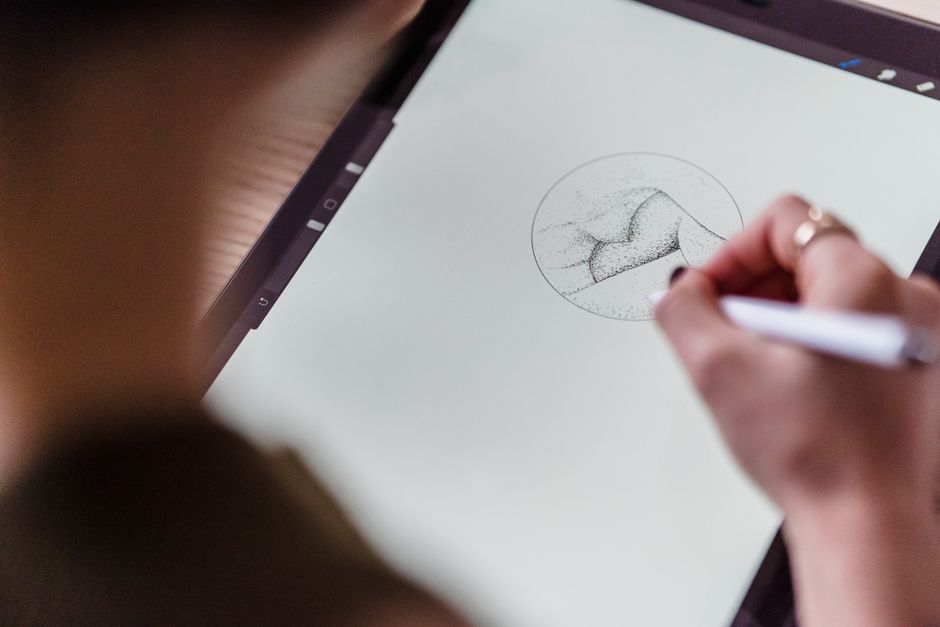 Drawing original art on a tablet with a stylus, a screen used to create